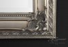 Classic silver ornate framed mirror corner